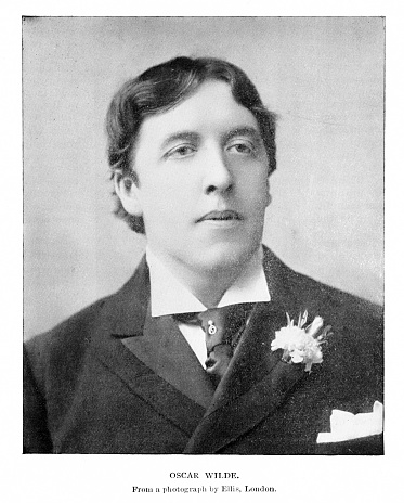Portrait of Oscar Wilde, an Irish poet, novelist, and dramatist.  Photograph engraving published 1894. The original edition is in my archives. Copyright has expired and is in Public Domain.