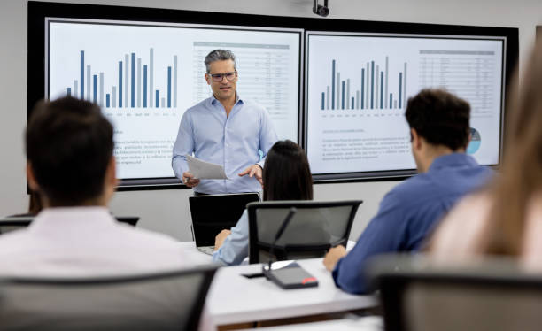 istock Teacher teaching an MBA class to a group of students 2048384002