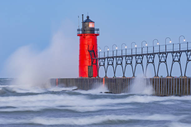 istock Summer, South Haven Lighthouse and Splashing Wave 2048387297