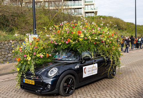 Noordwijk, Netherlands - April 22, 2023: Cars decorated with flowers taking part in the Bloemencorso Bollenstreek the annual spring flower parade from Noordwijk to Haarlem in the Netherlands.