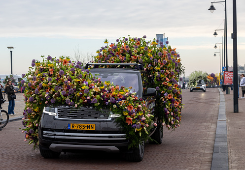Noordwijk, Netherlands - April 22, 2023: Cars decorated with flowers taking part in the Bloemencorso Bollenstreek the annual spring flower parade from Noordwijk to Haarlem in the Netherlands.