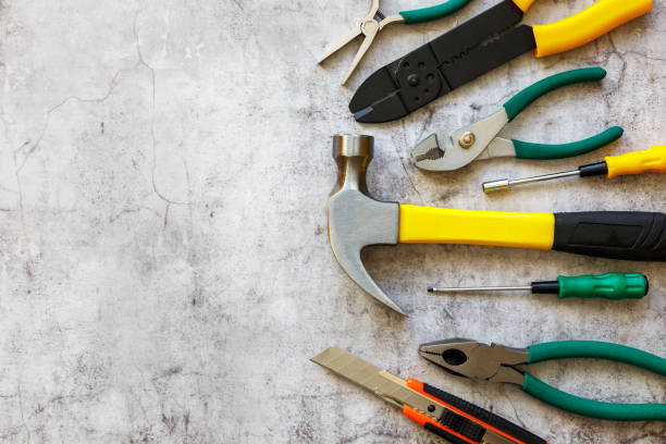 istock A set of hand tools on a concrete floor. Copy space. 2048393623