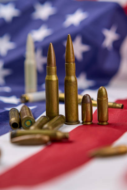 istock Rifle ammunition with a United States flag. 2048396257