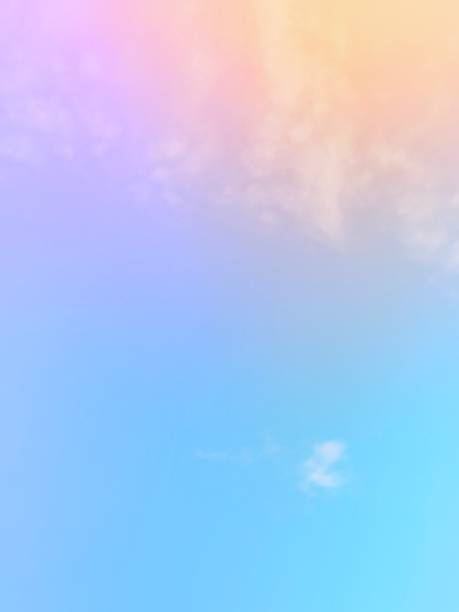 istock The subtlety of the soft faded clouds  On a pastel gradient rainbow sky background.  Beautiful combinations of pink, orange, red, purple and blue. 2048411492