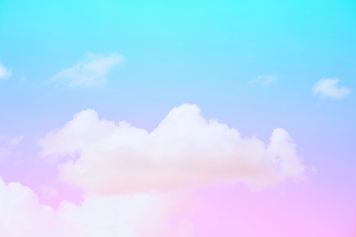 The subtlety of the soft faded clouds  On the pastel gradient sky background  Beautiful combination of pink, purple and blue.