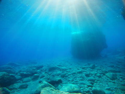Underwater sea background with rocky bottom