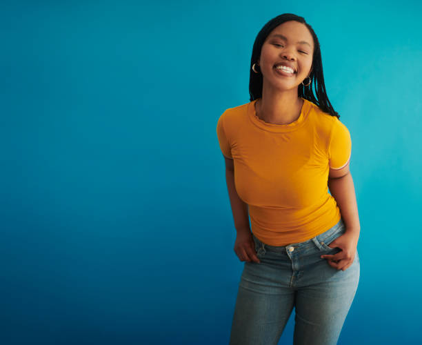 istock A beautiful black woman exuding confidence against a blue background 2048429310