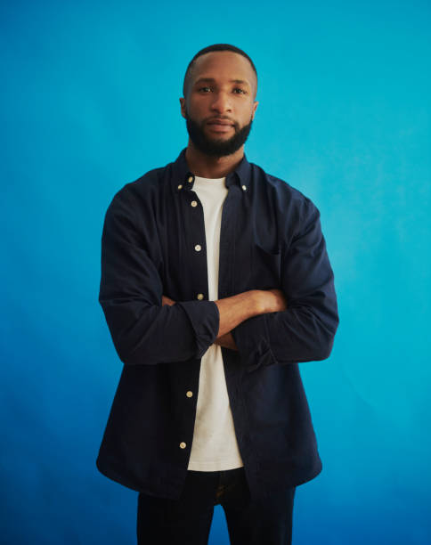 istock A Confident Young African Man Standing Against Blue Background 2048429827