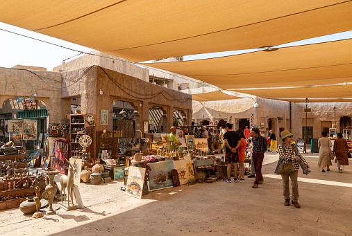 Dubai, United Arab Emirates - November 5, 2023: A picture of traditional shops at the Al Seef cultural and shopping complex.