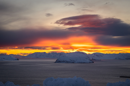 Arctic sunset on fjords, Northern Norway.\nHammerfest.