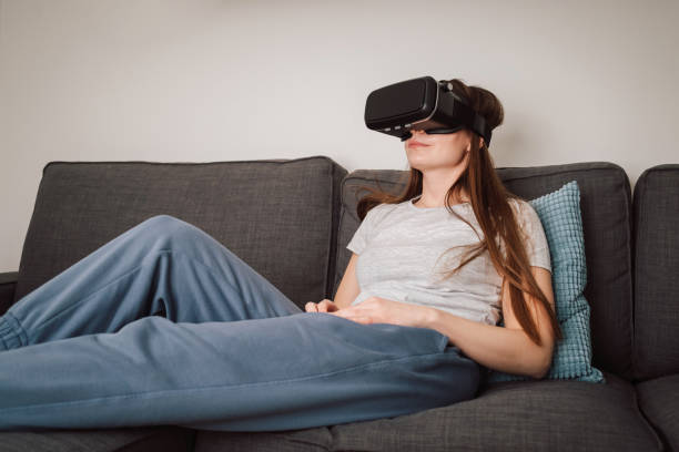 istock Woman with VR goggles traveling through the metaverse 2048471343