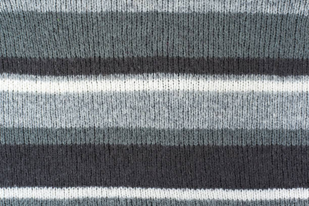 istock Sweater or scarf fabric texture large knitting. Knitted jersey background with a relief pattern. Wool hand- machine, handmade. 2048529854