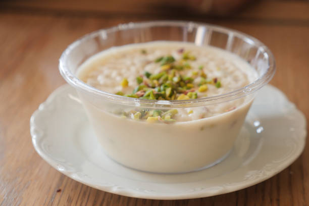 istock rice Caramel pudding in a glass jar on table 2048531448