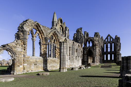 whitby abbey north yorkshire looking east into the ruin of the nave from the south west sunny day blue sky