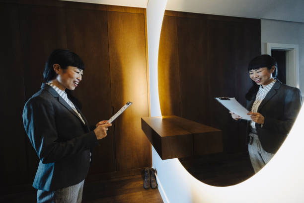 istock One woman, rehearsing a speech in mirror at home 2048543969