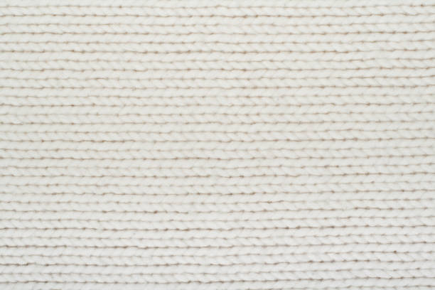 istock Sweater or scarf fabric texture large knitting. Knitted jersey background with a relief pattern. Wool hand- machine, handmade. 2048551454