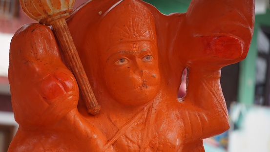 red statue of hanuman holding bhala