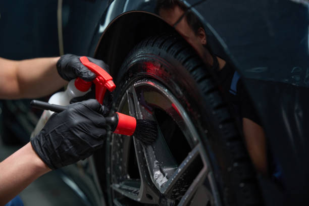 istock Auto service station worker is detailing client car 2048572213
