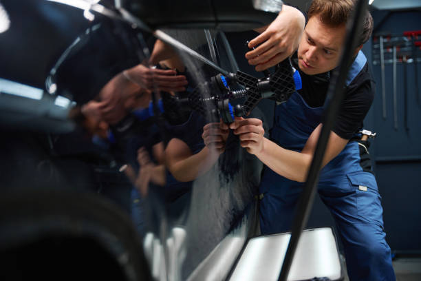 istock Qualified collision repair technician is straightening metal auto bodywork 2048572237