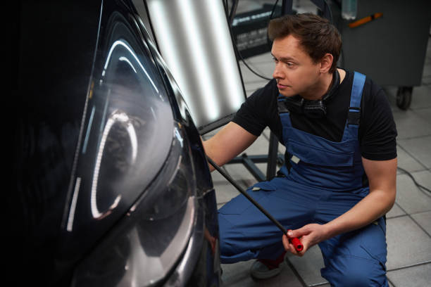 istock Professional auto body technician performing repair to damaged car bodywork 2048572251