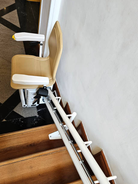 istock A stairlift for going up and down stairs an elevator system intended for elderly people or people with mobility problems, using a guide, it allows us to move through a mechanized chair 2048576438