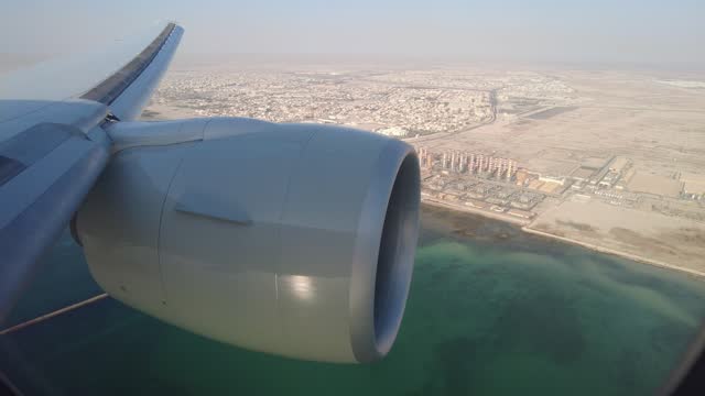 Qatar airways flying over Doha