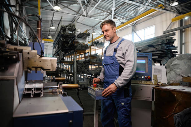 istock Professional production workers in coverall working with different PVC windows 2048609714