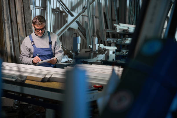 istock Process of assembling windows at factory for aluminum and PVC windows production 2048610220