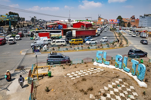 La Paz, Bolivia, October 16, 2023: View of the traffic on a street in the El Alto quarter of La Paz on a sunny day.
