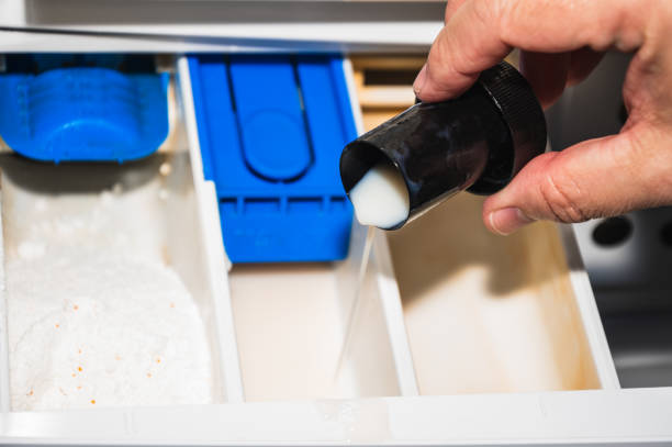 istock Close-up of man's hand putting plastic bottle into the drawer 2048620228