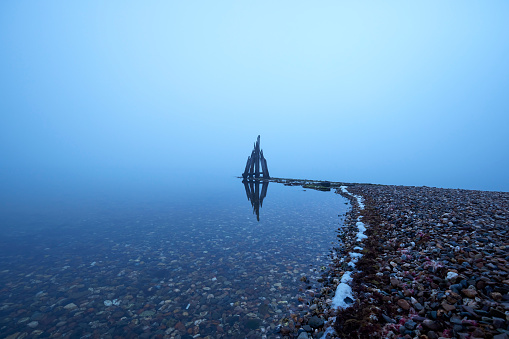 Den Osse Breakwaters in the mist, Zeeland, The Netherlands