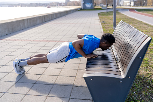 For a young African American man, fitness knows no borders, his outdoor workouts a declaration of freedom and flexibility, proving that great workouts aren't confined to the gym