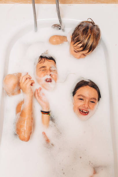 istock Children having fun washing in a bathtub together 2048721095