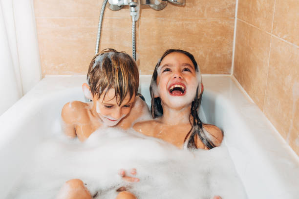 istock Children laughing and having fun while having their daily hygiene routine bathing at home 2048721614