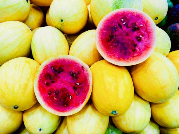 Yellow skin watermelon pink inside, fruit background