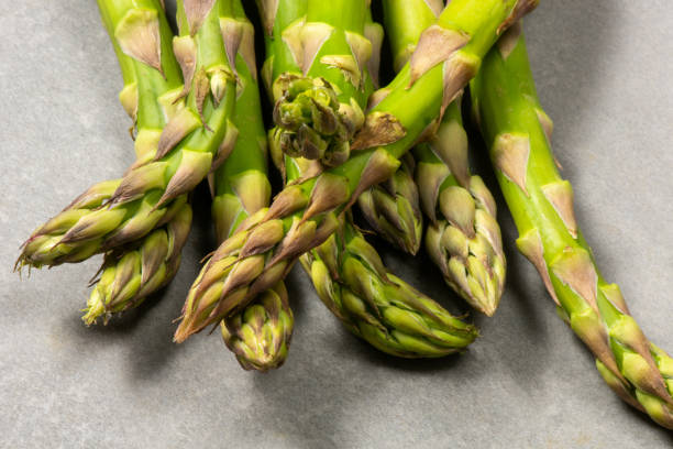 istock Fresh raw green Asparagus on stone 2048765218