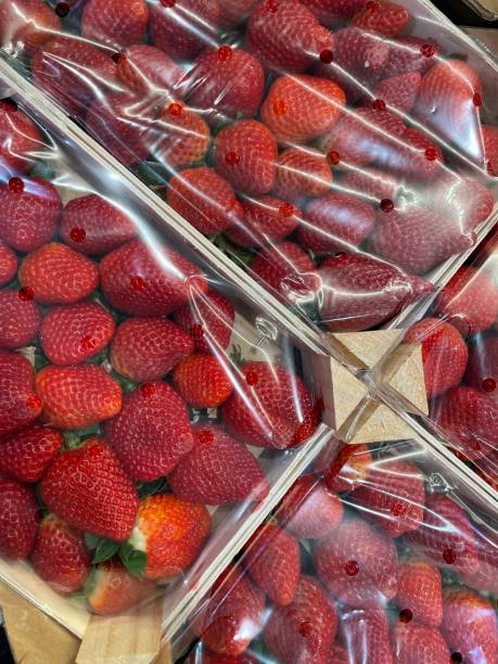 istock Fresh strawberries in boxes at the grocery store. 2048792294