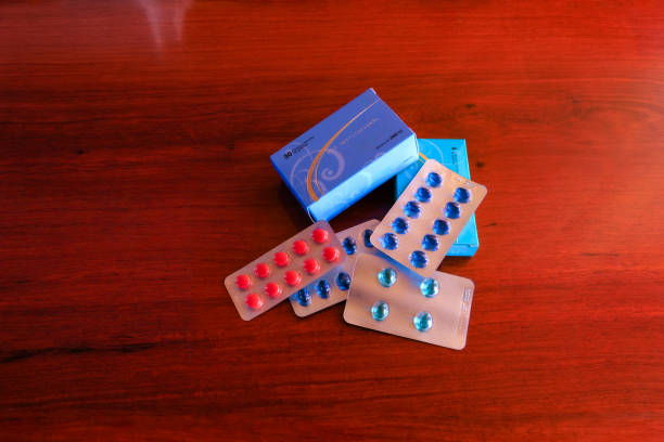 istock Vitamin D and B Complex in Blister Packs on a Rosewood Table 2048836843