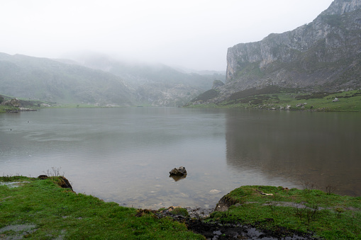 Ercina lake in the Covadonga lakes on a rainy day early in the morning. Asturias - Spain