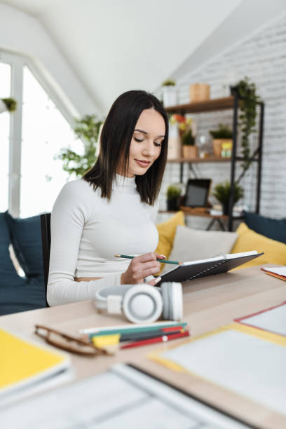 istock Modern Female Student Studying And Doing A Checklist For Herself 2048940605