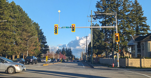 Surrey, Canada - November 13, 2023: Looking east on 96th Avenue at 152nd Street intersection. Sunny autumn afternoon in Metro Vancouver.
