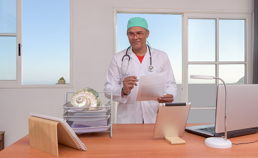 in his office looking at clients,blue sky on background