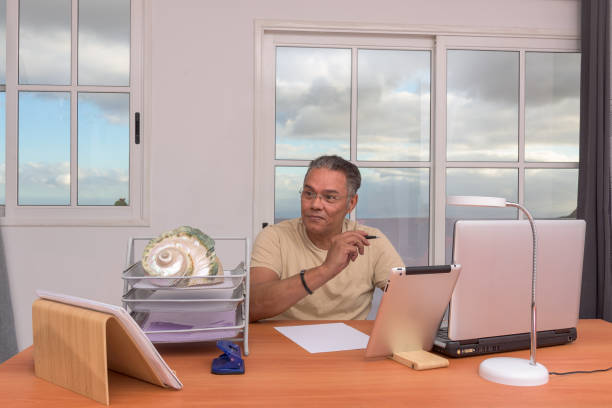 Thoughtful Professional Analyzing Data on a Laptop in Knokke-Heist, Flanders, Belgium