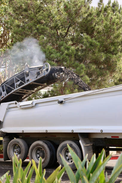 istock Milling machine removing the top layer of asphalt 2048992234