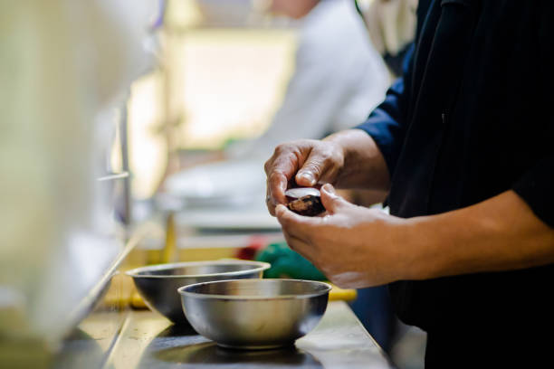 istock Professional cook working in the kitchen. Chef in action 2049052335