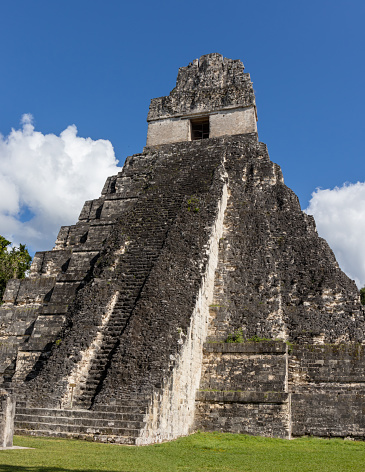 Mayan Temple Guatemala. Temple 1 or great jaguar temple in Tikal National Park on UNESCO World Heritage Site. The Grand Plaza.