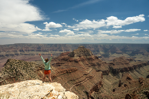 Woman Star Poses at the end of Cape Final Trail  in the Grand Canyon