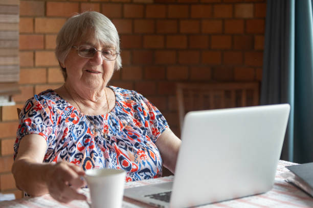 istock Senior woman at home using a laptop computer 2049128081