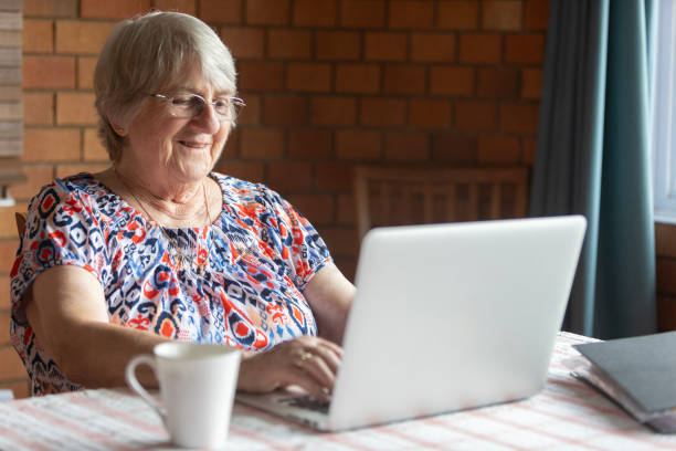 istock Senior woman at home using a laptop computer 2049128089