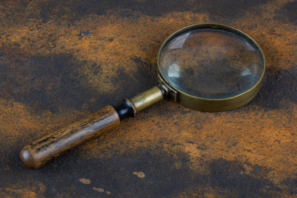 istock Vintage magnifying glass on metal rusty background, 2049130841